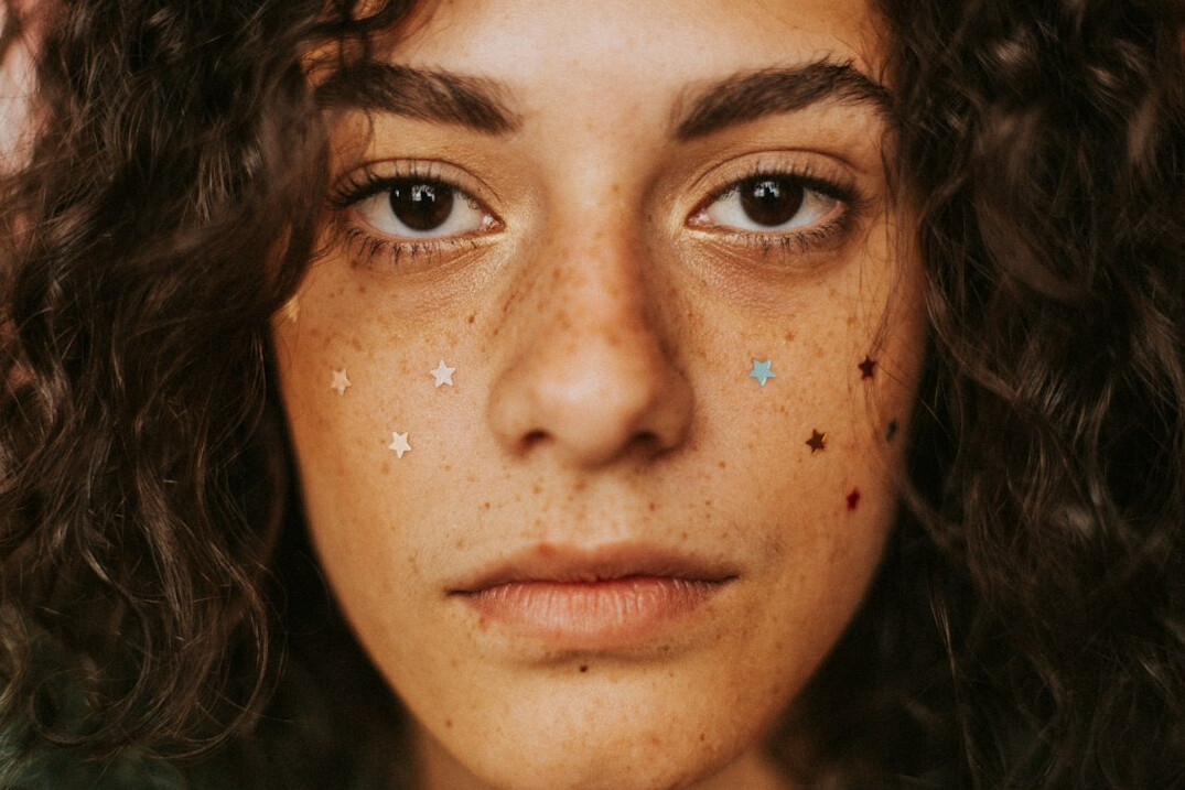 Brazilian woman looking confidently at camera representing personal growth
